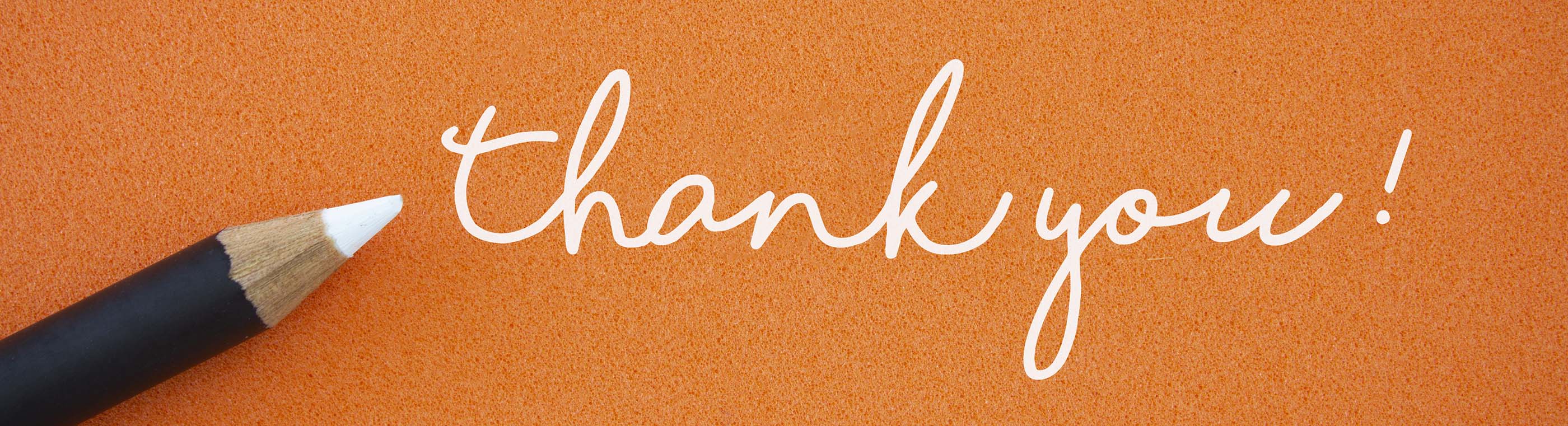 Thank you handwritten on an orange background